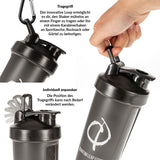 Der Premium Shaker in Schwarz mit Loop-Henkel lässt sich am Finger oder Karabiner tragen. Nahaufnahmen zeigen Grip und flexible, verstellbare Position - ideal in jeder Situation. Deutsche Texte erklären die Features.