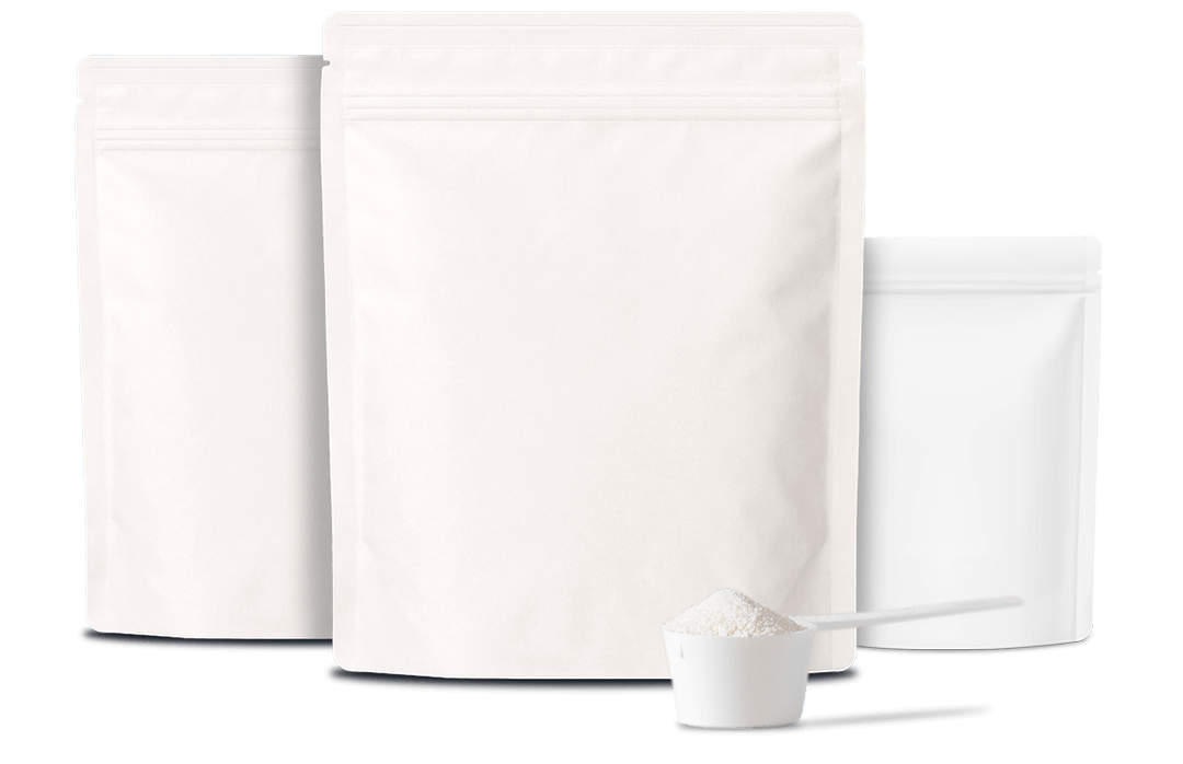 Three white refillable stand-up pouches with a scoop of white powder in front on white surface