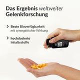 Hand pouring yellow capsules from black 3er Rock Solid bottle into palm with joint research benefits text on white background