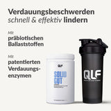 Abgebildet sind ein weißer QLF-Behälter mit der Aufschrift Solid Gut und eine schwarze Schüttelflasche. Der Text hebt den wissenschaftlichen Komplex für Darm-Gesundheit, Verdauungshilfe mit präbiotischen Ballaststoffen und verbesserte Nährstoff-Absorption hervor. Heller Hintergrund, fette und normale Schrift.