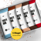 Tasty Bar Proteinriegel Probierbox mit fünf verschiedenen Sorten, elegant verpackt und übersichtlich präsentiert.